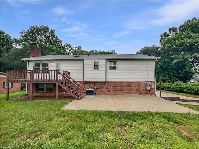 115 Wills Rd, Advance, NC 27006 - back of property featuring a chimney, a deck, a patio area, central AC, and a yard
