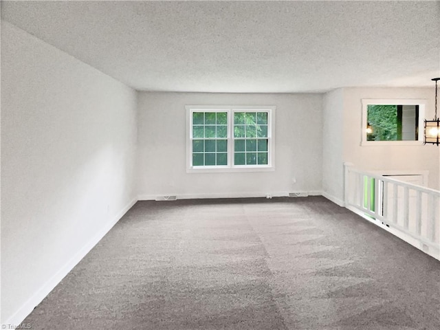 115 Wills Rd, Advance, NC 27006 - carpeted spare room with baseboards and a textured ceiling