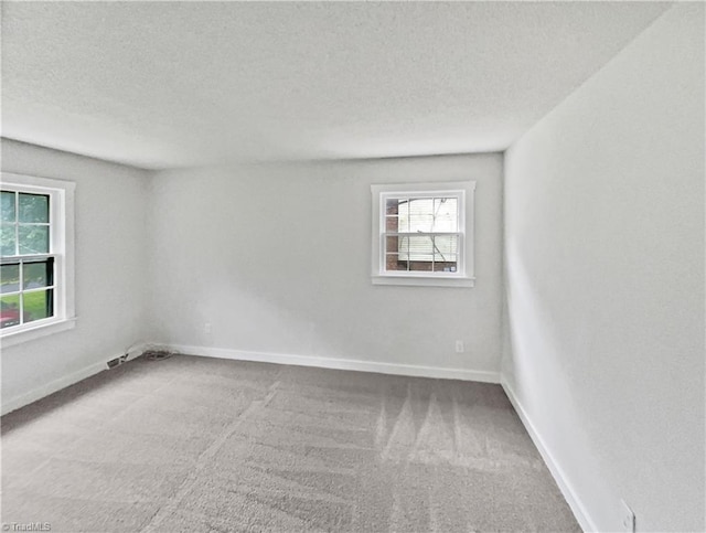 115 Wills Rd, Advance, NC 27006 - carpeted spare room featuring a textured ceiling and baseboards