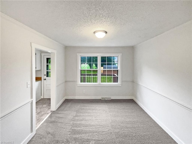 115 Wills Rd, Advance, NC 27006 - carpeted spare room featuring a textured ceiling and baseboards
