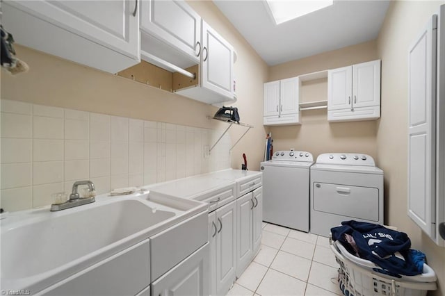 6303 Reata Ct, Summerfield, NC 27358 - laundry room with cabinet space, separate washer and dryer, and light tile patterned floors