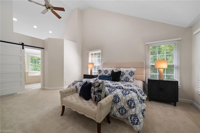 6303 Reata Ct, Summerfield, NC 27358 - carpeted bedroom featuring a barn door, multiple windows, high vaulted ceiling, ensuite bathroom, and recessed lighting