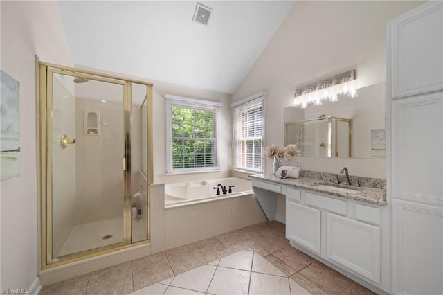 6303 Reata Ct, Summerfield, NC 27358 - bathroom with a bath, tile patterned flooring, a stall shower, vanity, and high vaulted ceiling