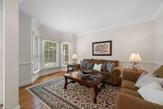 6303 Reata Ct, Summerfield, NC 27358 - living room featuring wood finished floors and crown molding