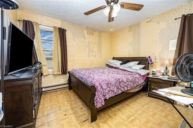 bedroom featuring wallpapered walls, ceiling fan, a baseboard heating unit, and a textured ceiling