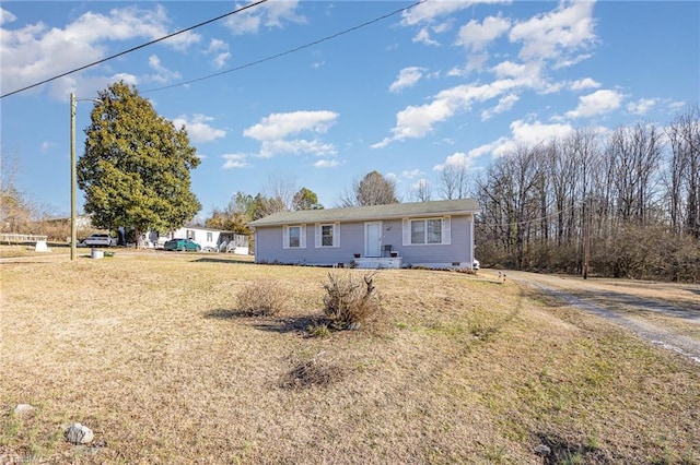 ranch-style home featuring crawl space and a front yard