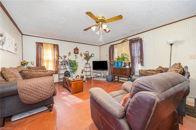 living area with light floors, ornamental molding, a ceiling fan, a textured ceiling, and wallpapered walls