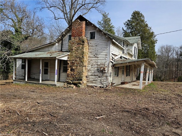 rear view of house with a porch