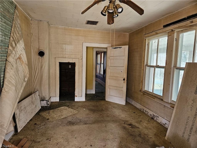 interior space featuring ceiling fan