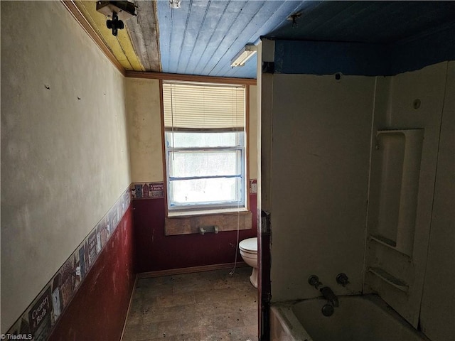 bathroom featuring toilet, washtub / shower combination, and wooden ceiling