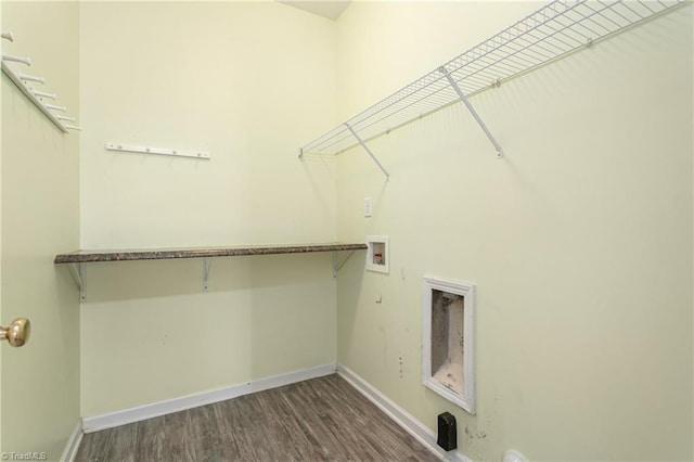 laundry area with laundry area, hookup for a washing machine, wood finished floors, and baseboards