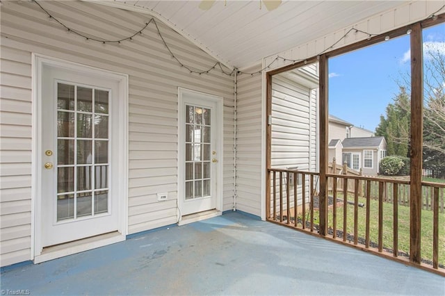 unfurnished sunroom featuring lofted ceiling