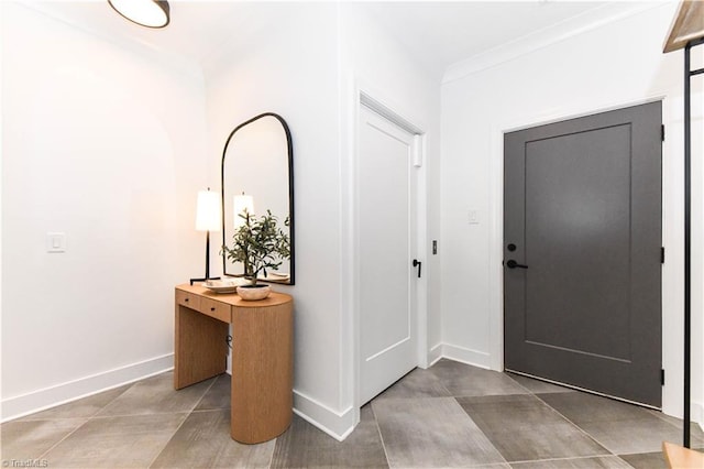 foyer featuring baseboards