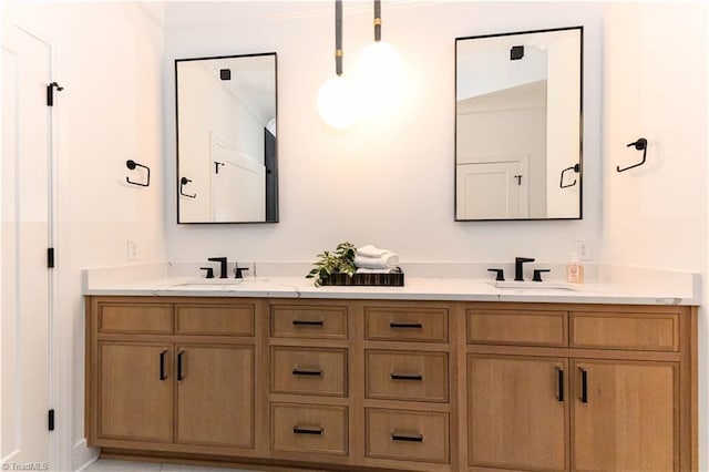bathroom featuring double vanity and a sink