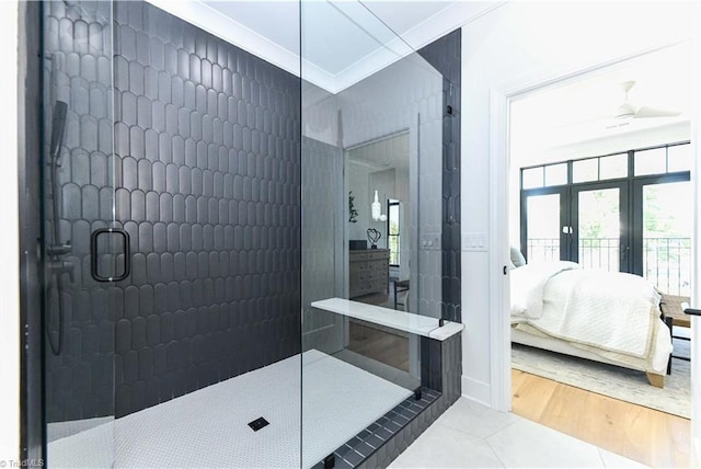 bathroom featuring french doors, crown molding, tile patterned flooring, walk in shower, and connected bathroom