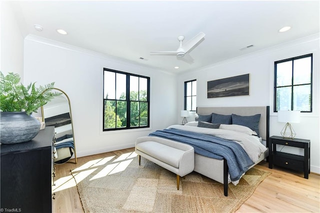 bedroom featuring baseboards, visible vents, and ornamental molding