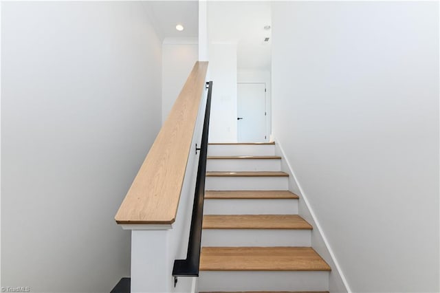 staircase with recessed lighting