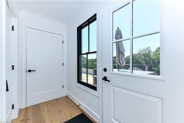 doorway with light wood-style flooring