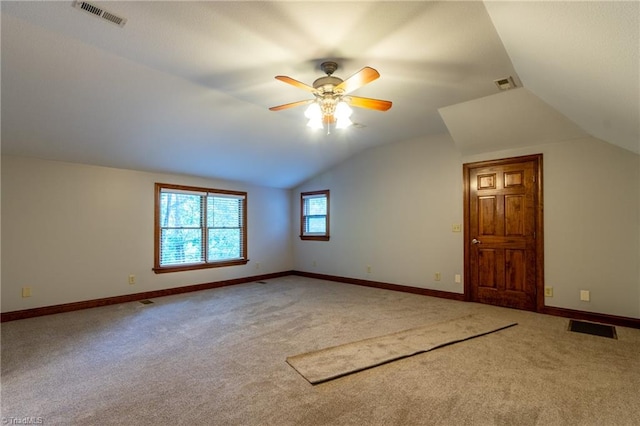 additional living space featuring ceiling fan, carpet floors, and vaulted ceiling