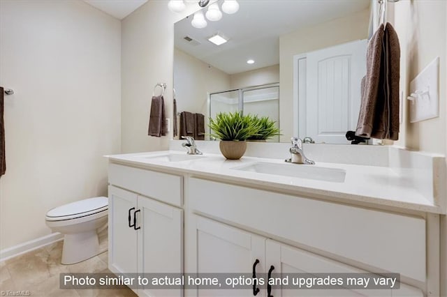 full bathroom featuring a sink, a shower stall, double vanity, and visible vents