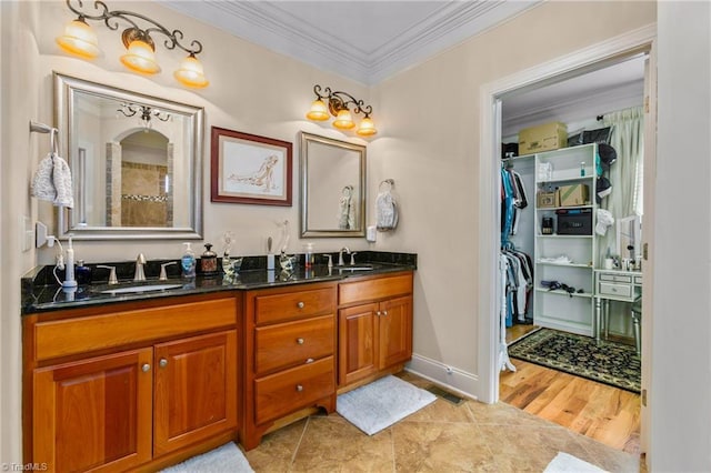 bathroom with hardwood / wood-style floors, vanity, and ornamental molding