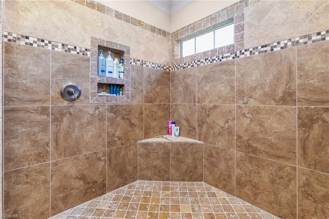 bathroom featuring tiled shower