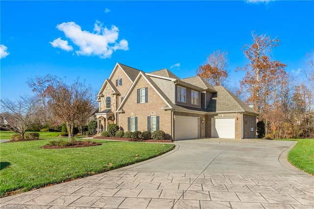 view of front of house with a garage and a front lawn