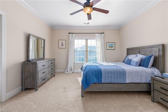 carpeted bedroom featuring ceiling fan and crown molding