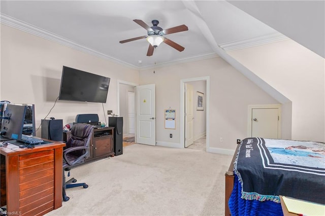 carpeted home office with ceiling fan, crown molding, and vaulted ceiling