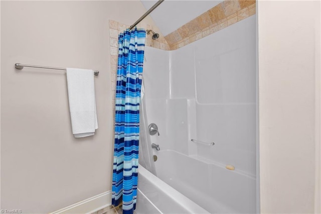 bathroom with shower / bath combo