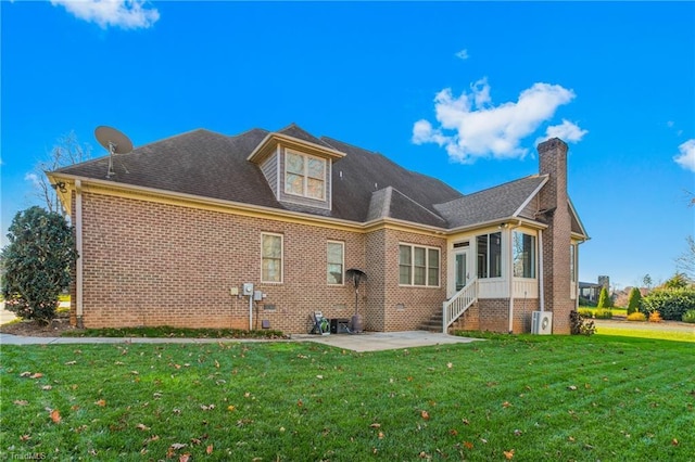 rear view of property with a patio area and a yard