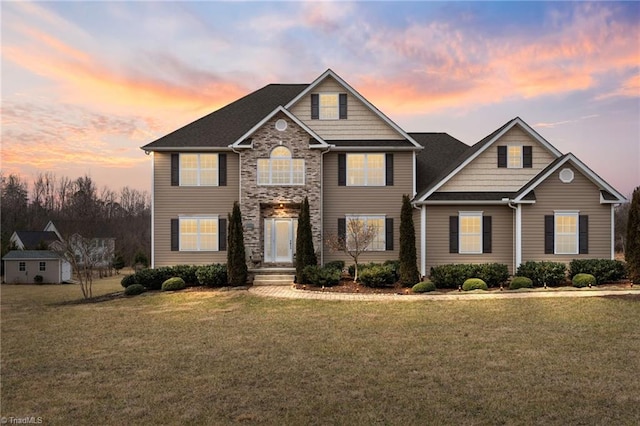 view of front of home featuring a lawn