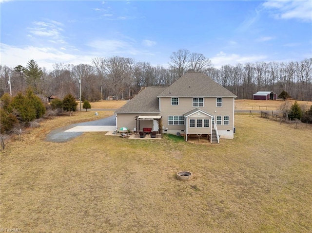 back of property featuring a lawn