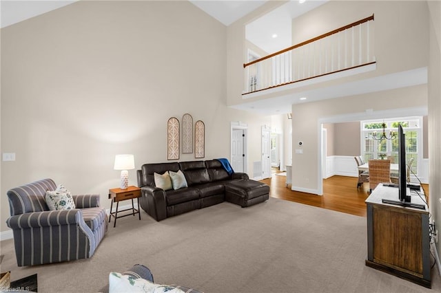 153 Montauk Ct, Clemmons, NC 27012 - living area with carpet floors, a towering ceiling, wood finished floors, and recessed lighting