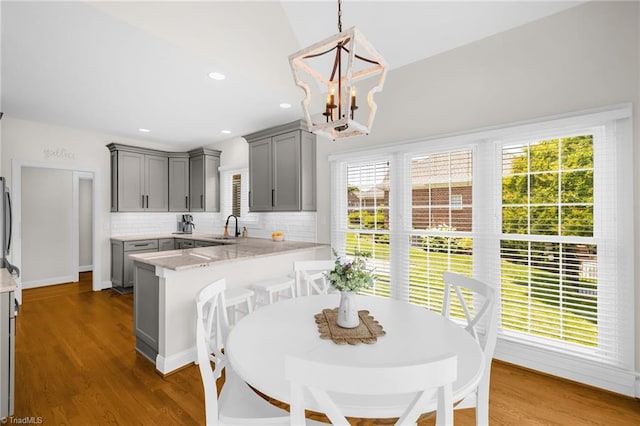 153 Montauk Ct, Clemmons, NC 27012 - dining space with a chandelier, dark wood-style floors, and recessed lighting