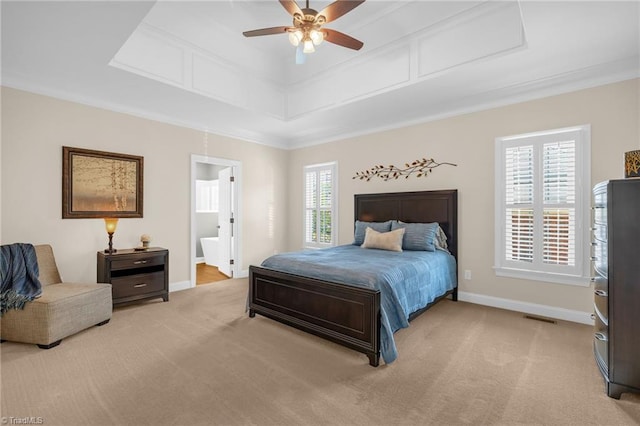 153 Montauk Ct, Clemmons, NC 27012 - carpeted bedroom with ensuite bathroom, ceiling fan, crown molding, and a tray ceiling