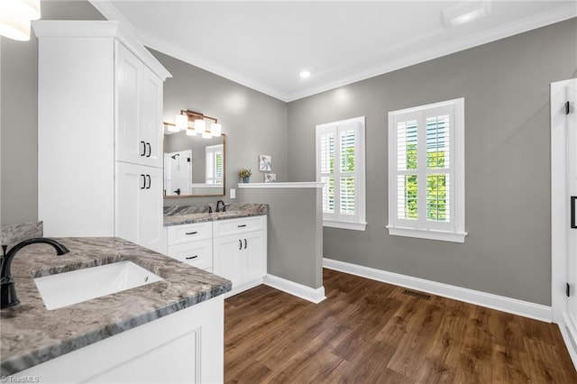 153 Montauk Ct, Clemmons, NC 27012 - bathroom featuring wood finished floors, two vanities, crown molding, and recessed lighting