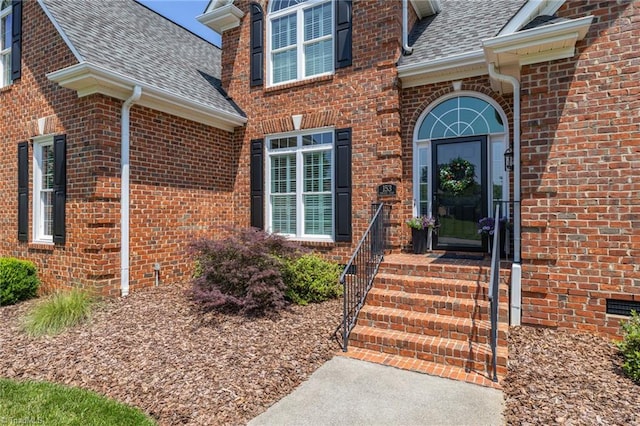 153 Montauk Ct, Clemmons, NC 27012 - property entrance featuring a shingled roof and brick siding