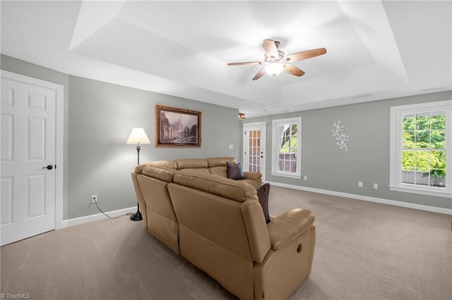 153 Montauk Ct, Clemmons, NC 27012 - living area with a raised ceiling, light colored carpet, ceiling fan, and healthy amount of natural light