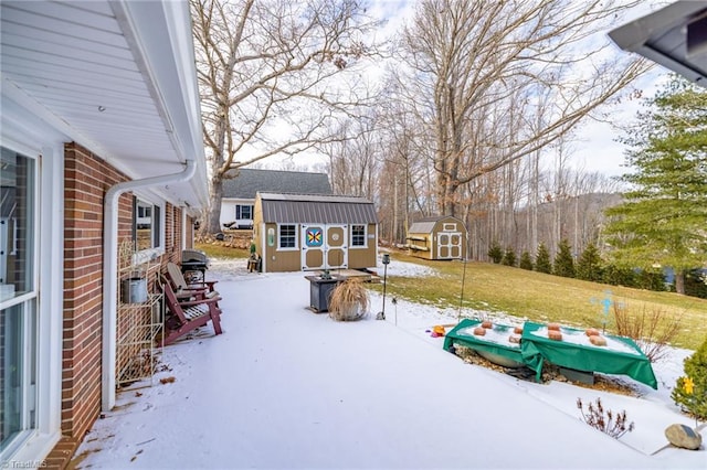 144 Collins Rd, Sparta, NC 28675 - yard layered in snow with a storage unit