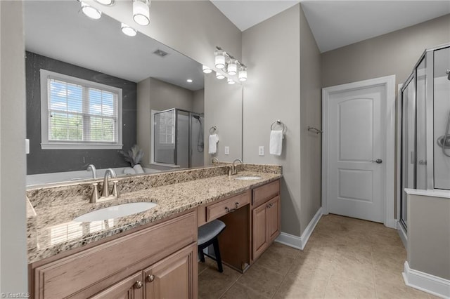 full bathroom with double vanity, a sink, tile patterned flooring, and a shower stall