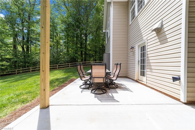 view of patio with fence and outdoor dining area