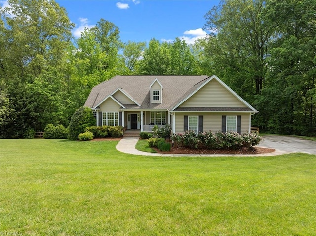 view of front of house featuring covered porch and a front yard