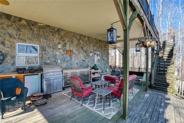 wooden deck featuring stairs, area for grilling, and grilling area