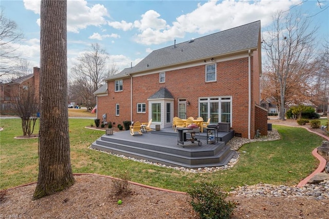 rear view of property featuring an outdoor hangout area, a deck, and a lawn