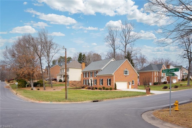 exterior space featuring a garage and a front lawn