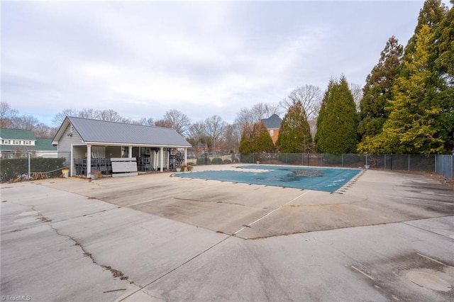 view of swimming pool with a grill and a patio area