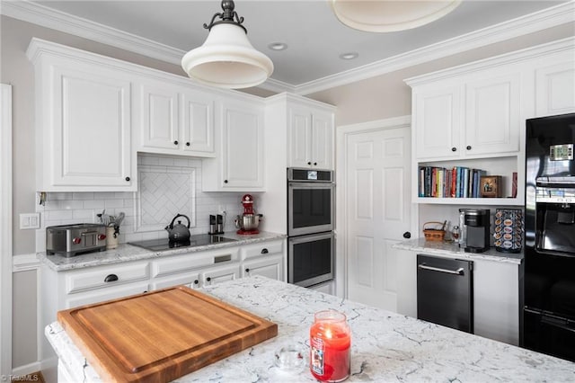 kitchen with decorative light fixtures, white cabinetry, light stone counters, black appliances, and crown molding