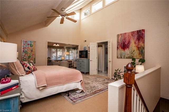 carpeted bedroom featuring multiple windows, lofted ceiling, and ceiling fan