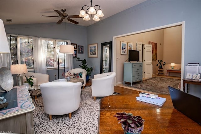 living room featuring lofted ceiling and ceiling fan with notable chandelier